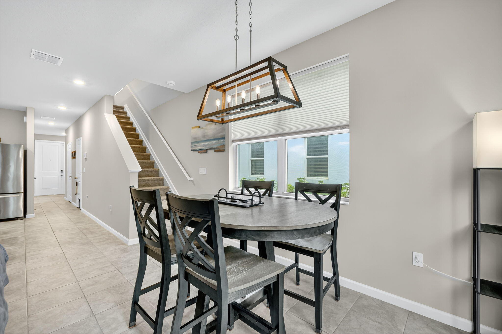 5672 Southeast Edgewater Circle Stuart, FL 34997 - Photo 9 of 26 a view of a dining room with furniture and window