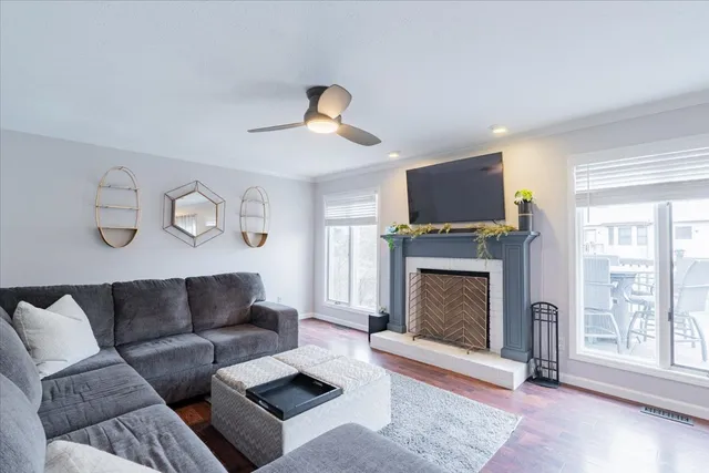 a living room with furniture a window and a fireplace