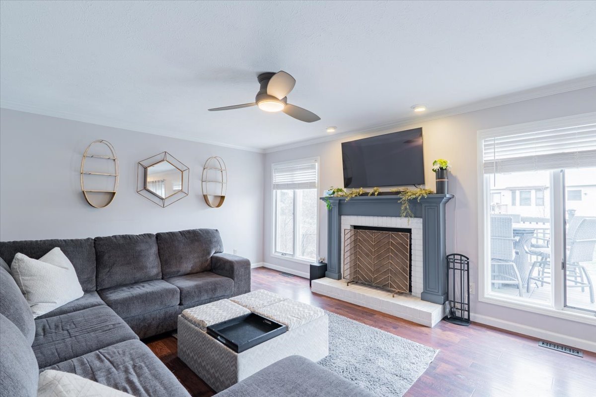 607 Old Farm Road Bloomington, IL 61704 - Photo 12 of 40 a living room with furniture a window and a fireplace