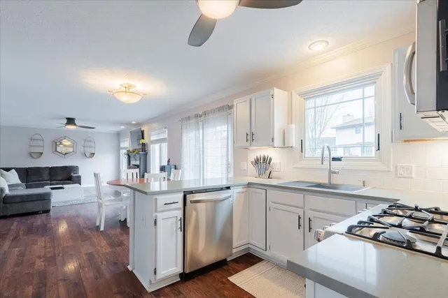 a kitchen with a sink stove and cabinets