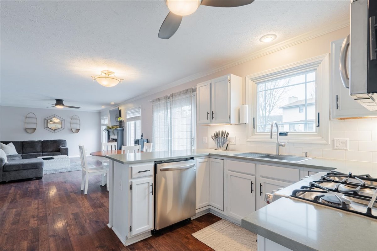 607 Old Farm Road Bloomington, IL 61704 - Photo 17 of 40 a kitchen with a sink stove and cabinets