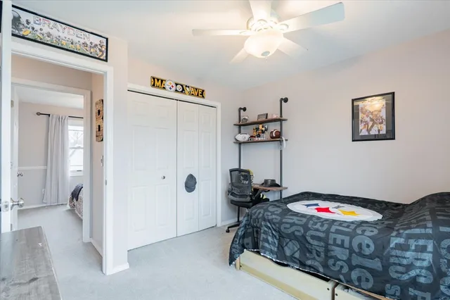 a bed room with a bed and a chandelier