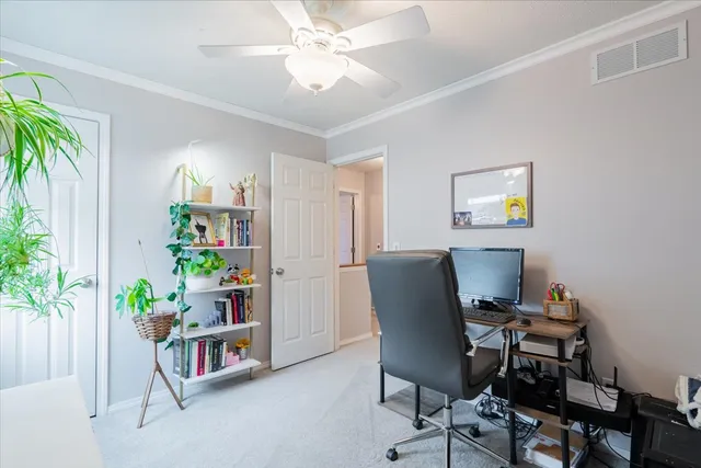a workspace with furniture and a potted plant