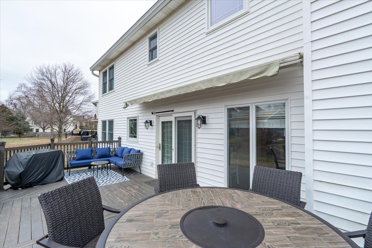 607 Old Farm Road Bloomington, IL 61704 - Photo 34 of 40 a view of a house with couches chairs and a fire pit
