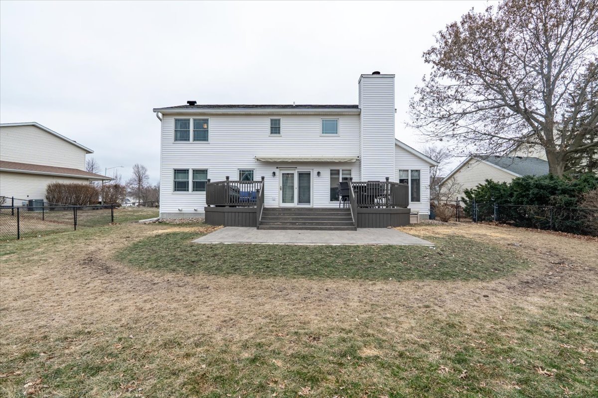 607 Old Farm Road Bloomington, IL 61704 - Photo 38 of 40 a front view of a house with a yard