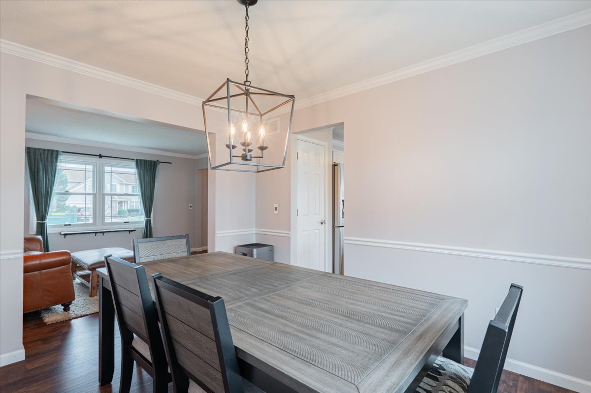 607 Old Farm Road Bloomington, IL 61704 - Photo 8 of 40 a view of a dining room with furniture window and wooden floor