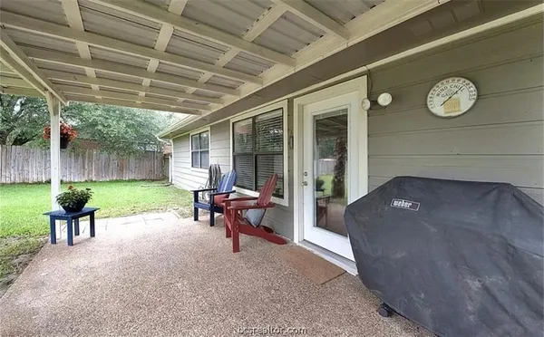 a view of a patio with chair and table