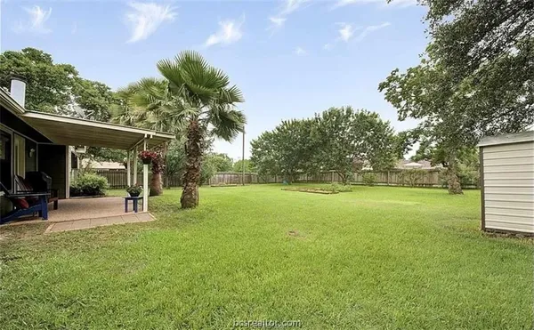a view of a park with swings and slides