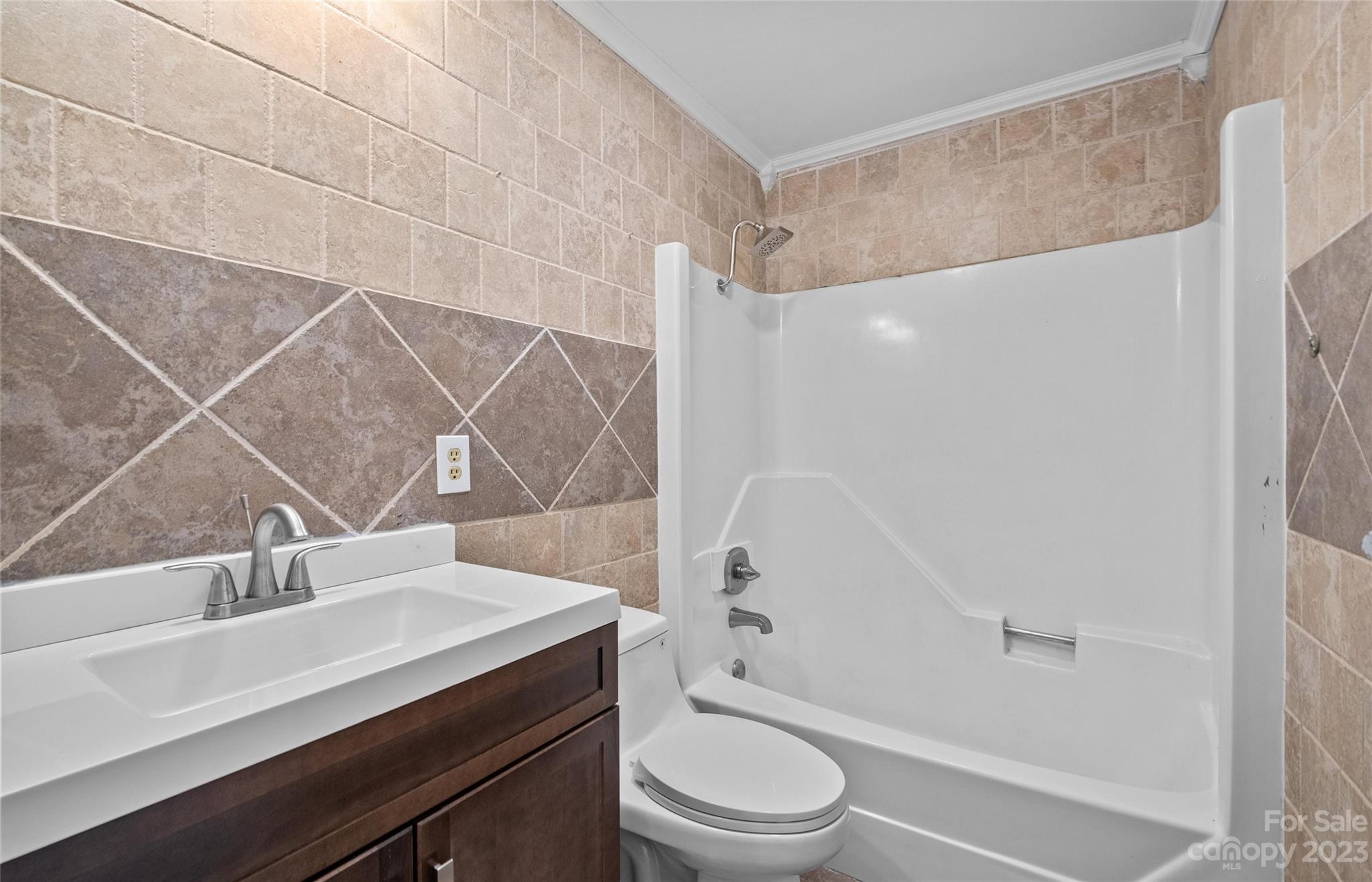 5100 Grand Canyon Road Northwest Concord, NC 28027 - Photo 12 of 39 a bathroom with a sink a toilet and shower