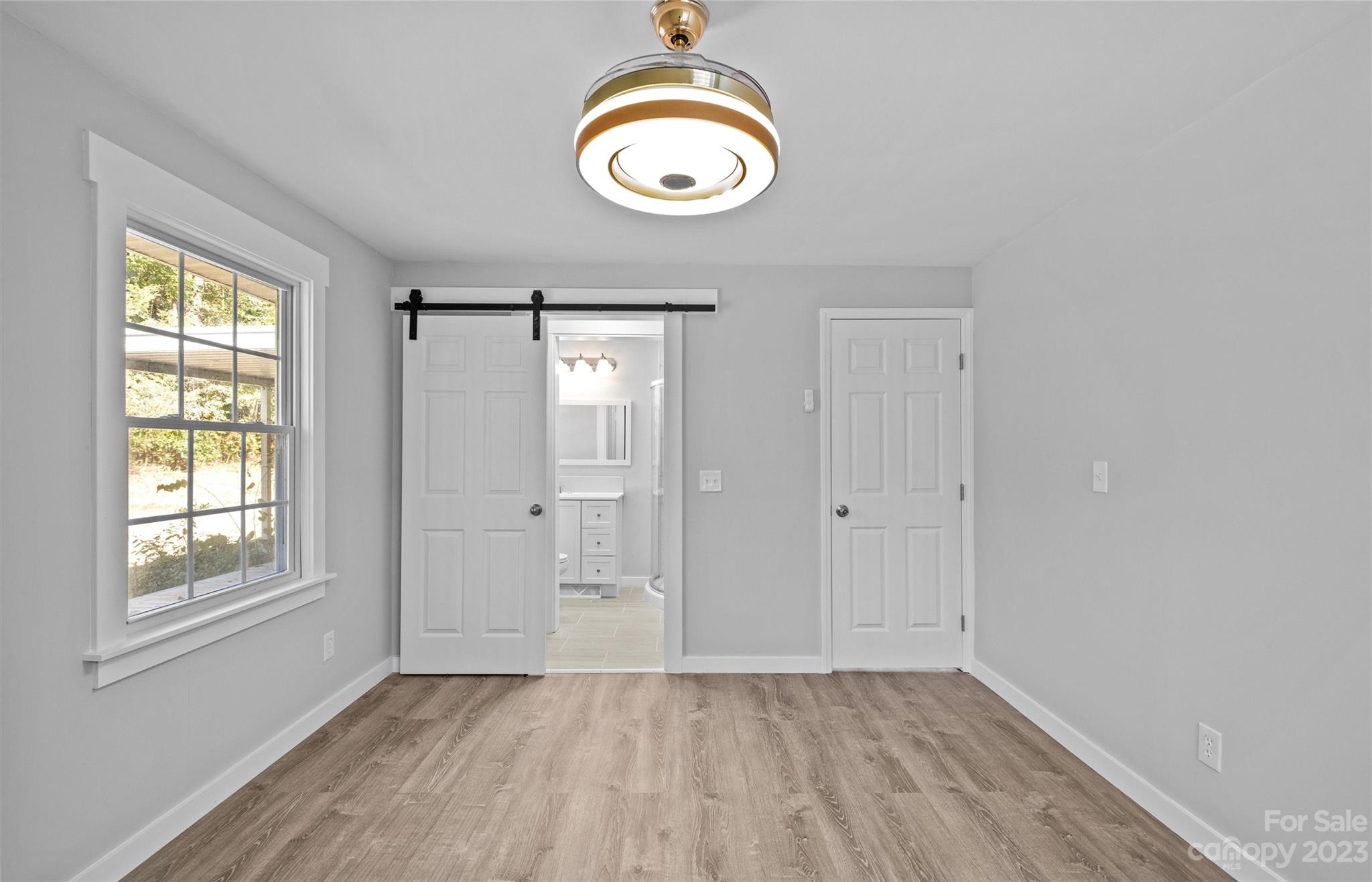 5100 Grand Canyon Road Northwest Concord, NC 28027 - Photo 16 of 39 wooden floor in an empty room with a window