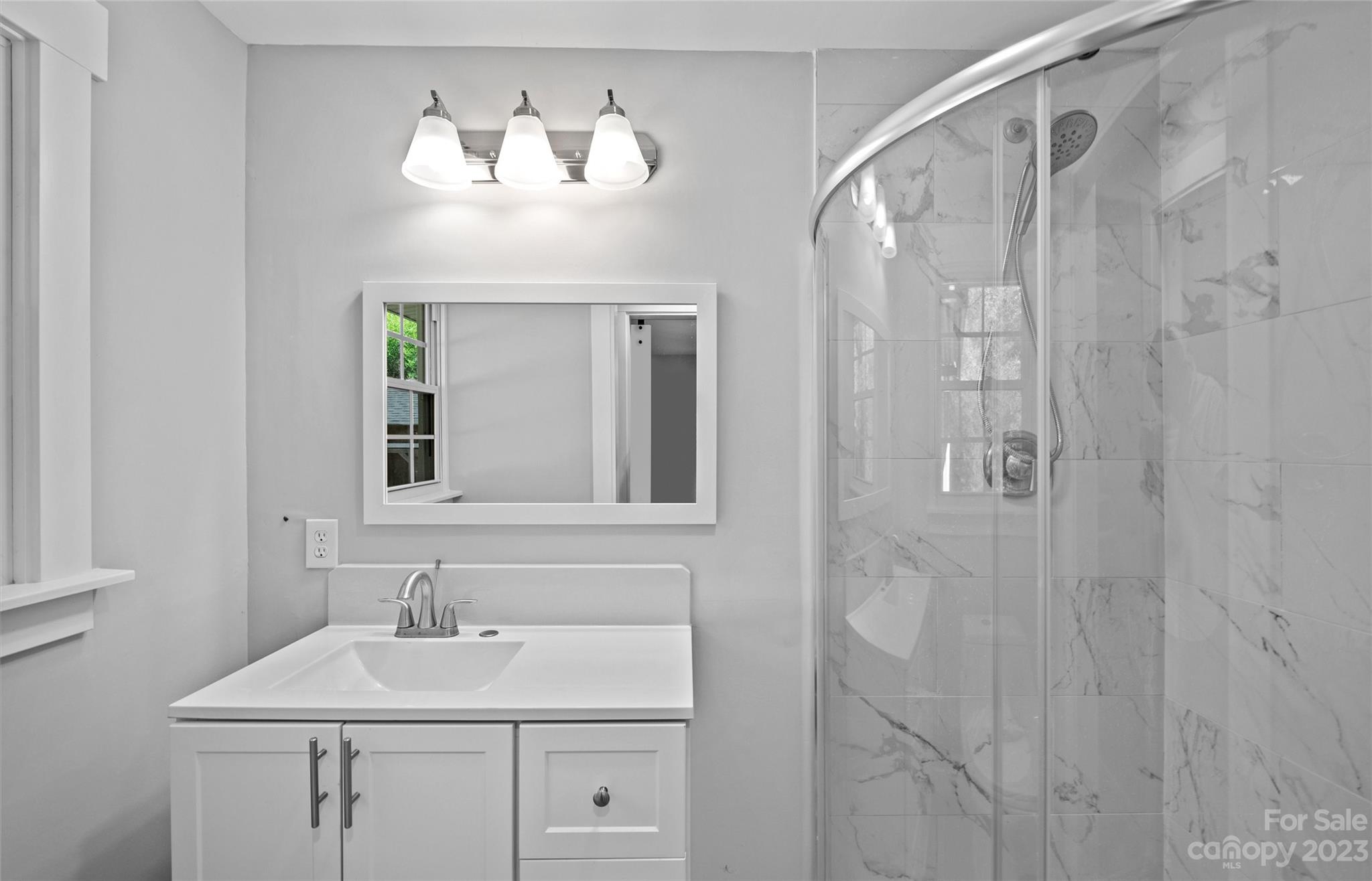 5100 Grand Canyon Road Northwest Concord, NC 28027 - Photo 17 of 39 a bathroom with a sink and a mirror