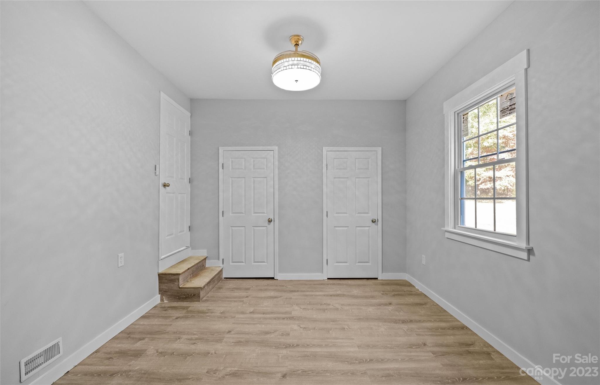 5100 Grand Canyon Road Northwest Concord, NC 28027 - Photo 19 of 39 a view of a livingroom with wooden floor and window