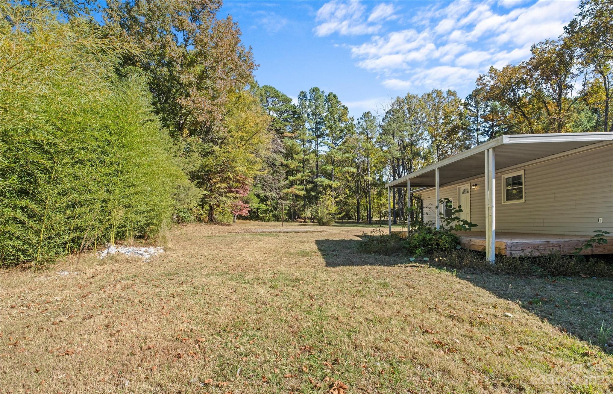 5100 Grand Canyon Road Northwest Concord, NC 28027 - Photo 25 of 39 a view of a yard with plants and trees