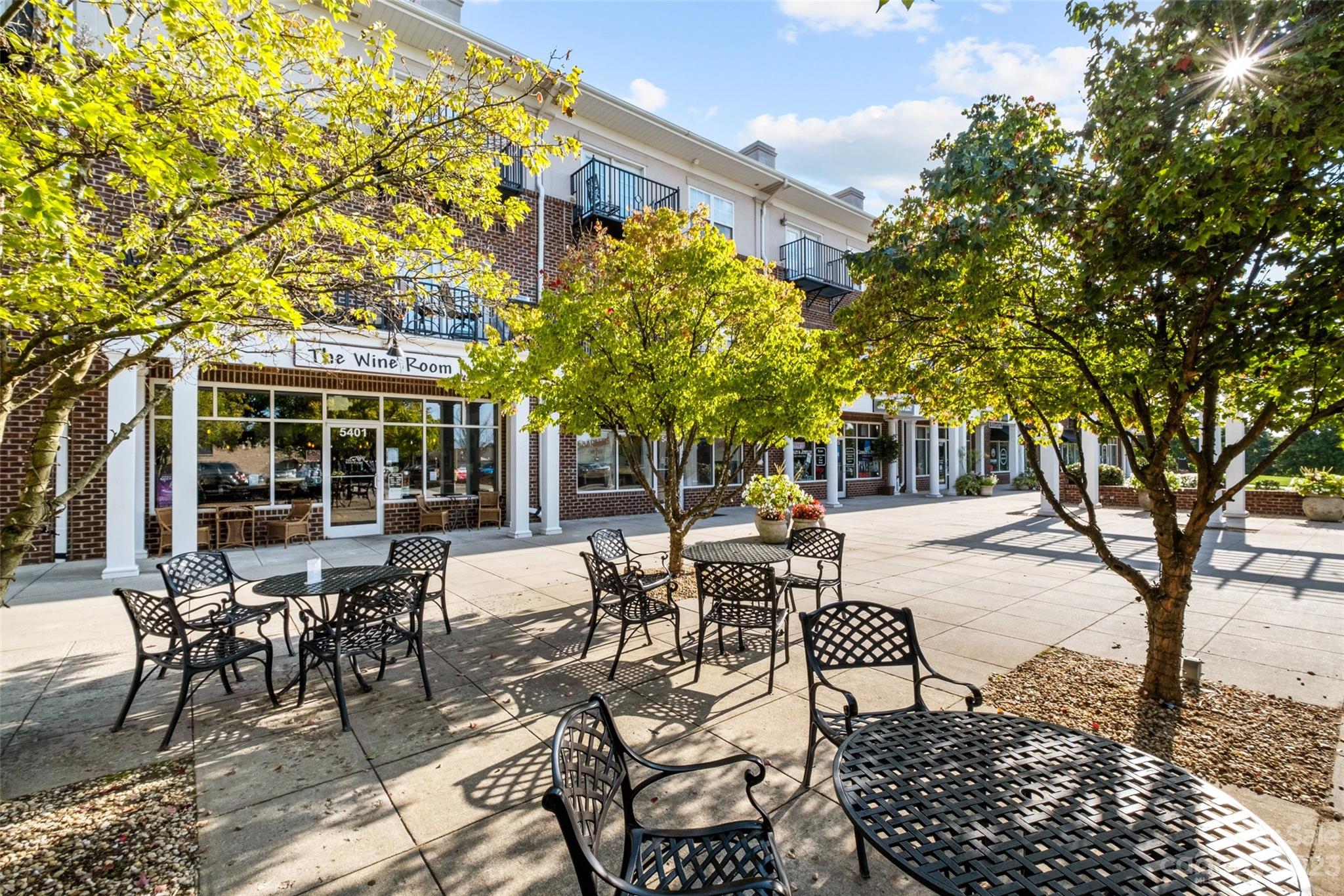 5100 Grand Canyon Road Northwest Concord, NC 28027 - Photo 35 of 39 a view of a patio with table and chairs and potted plants