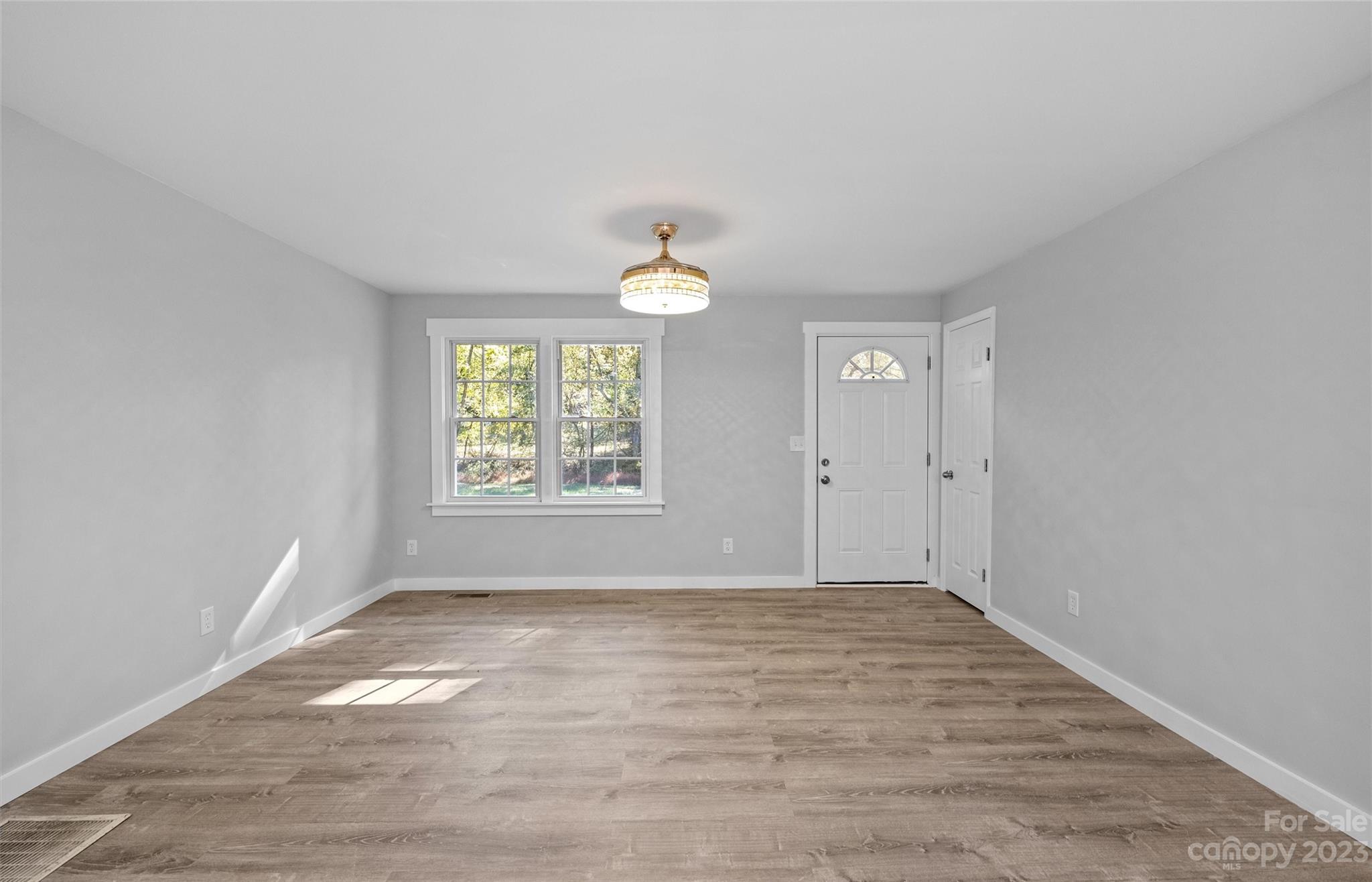 5100 Grand Canyon Road Northwest Concord, NC 28027 - Photo 9 of 39 wooden floor in an empty room with a window
