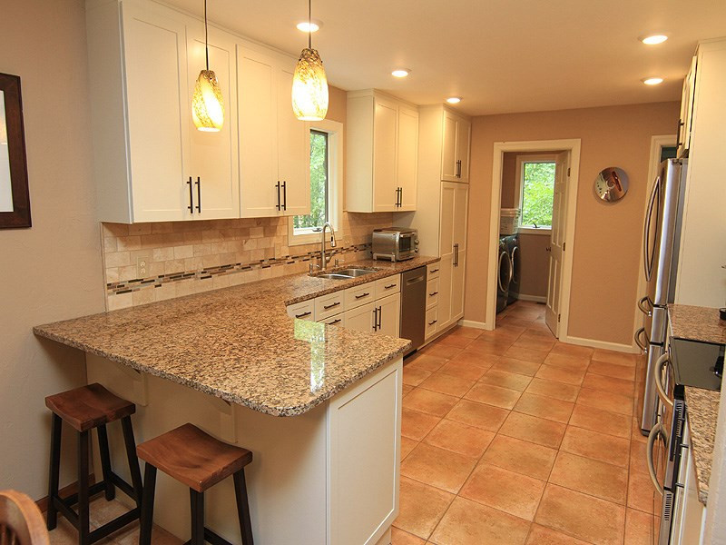 2417 Pleasant Union Church Road Raleigh, NC 27614 - Photo 5 of 25 High end cabinets and new light fixtures. Kitchen