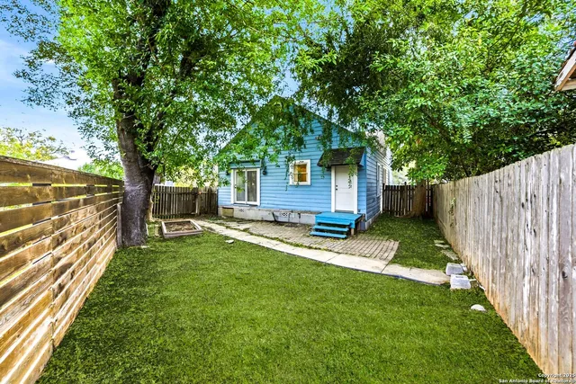 a backyard of a house with seating space