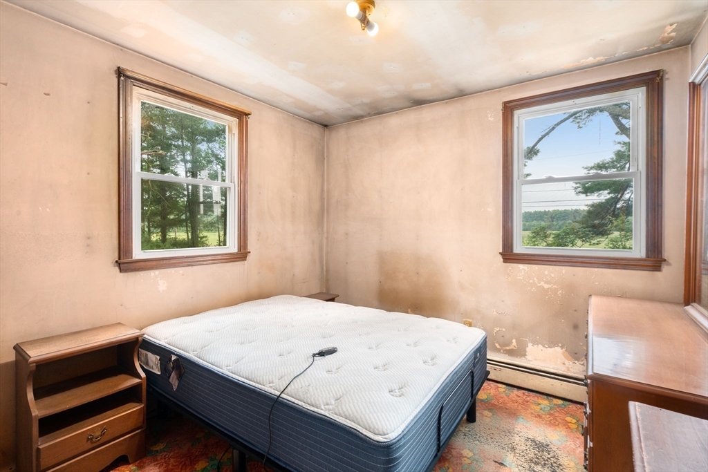 531 Marys Pond Road Rochester, MA 02770 - Photo 20 of 38 a bedroom with a bed and a window