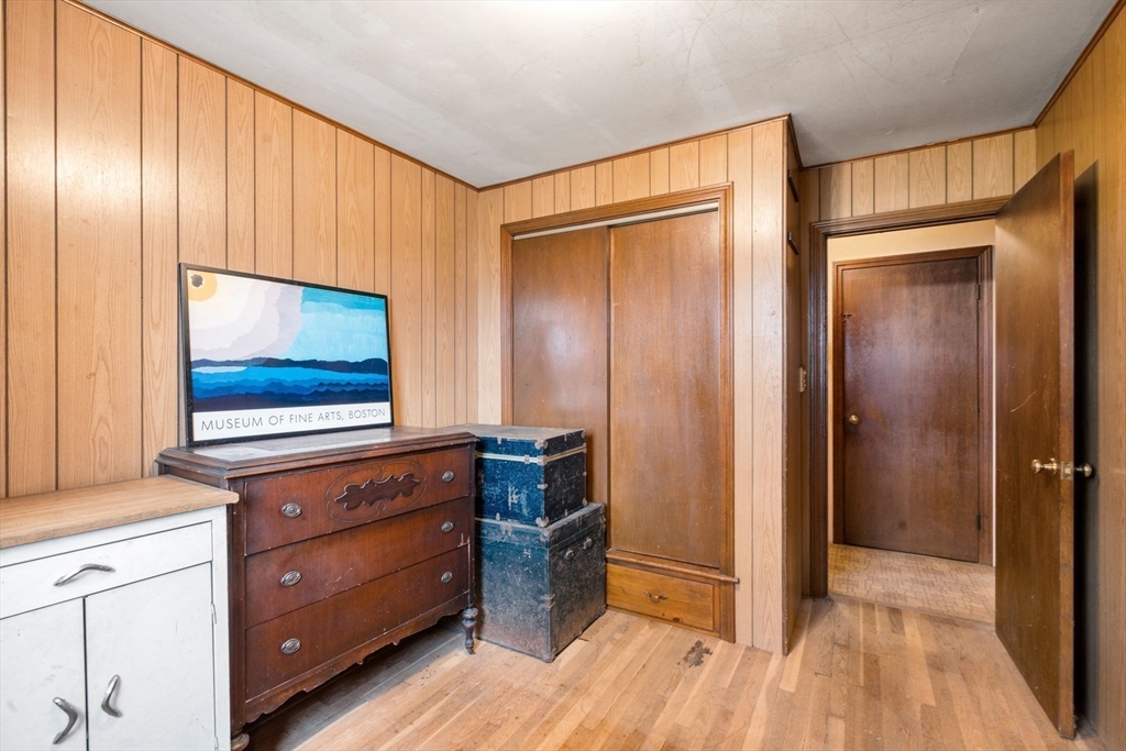531 Marys Pond Road Rochester, MA 02770 - Photo 23 of 38 a view of room with wooden floor and cabinet