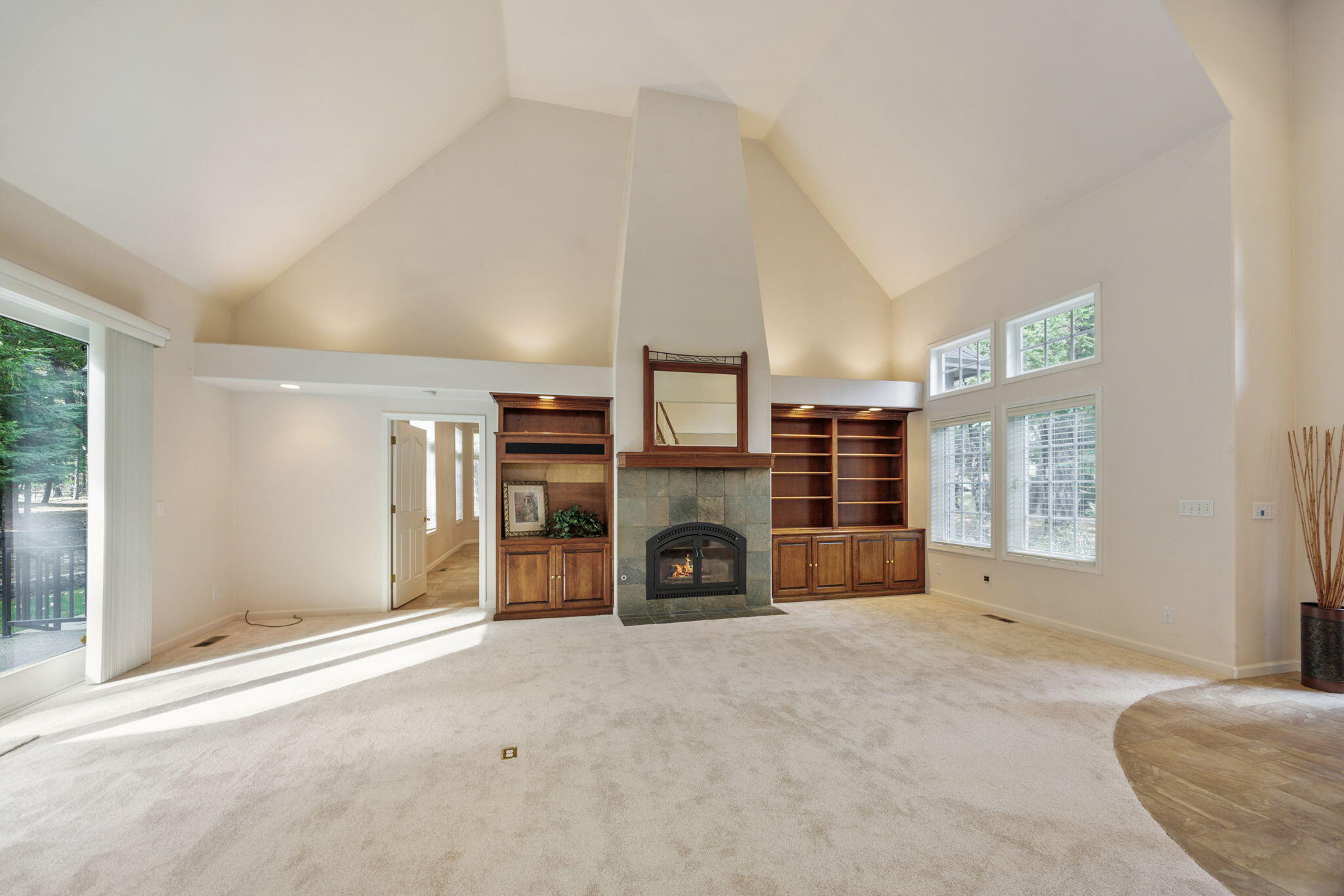 7081 Redthorne Road Rogue River, OR 97537 - Photo 14 of 58 an empty room with furniture and fireplace