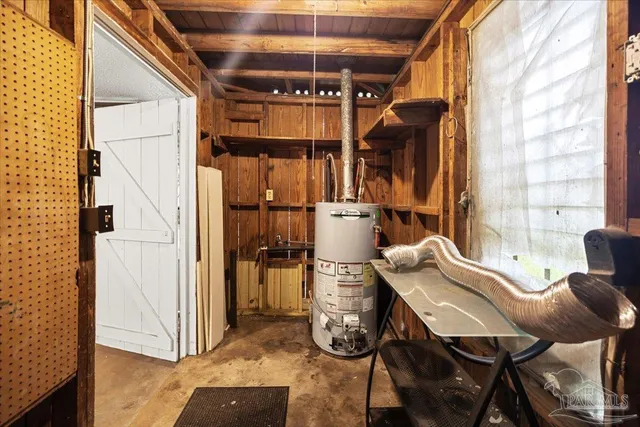 a view of a dining room with furniture and a window