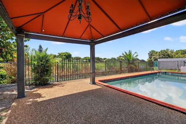 a view of a backyard with a patio