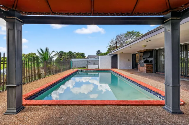 a view of swimming pool with a patio