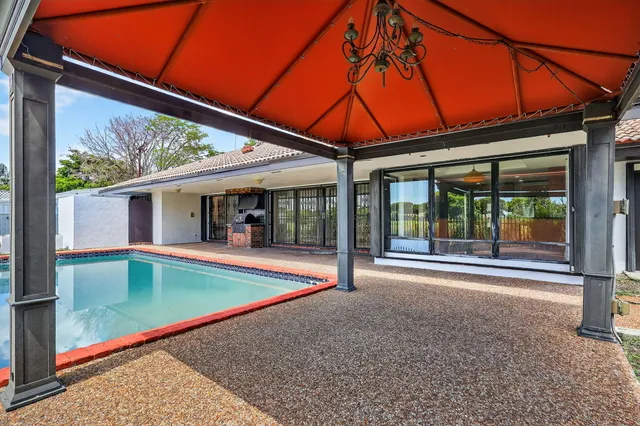 a view of a backyard with a patio and backyard