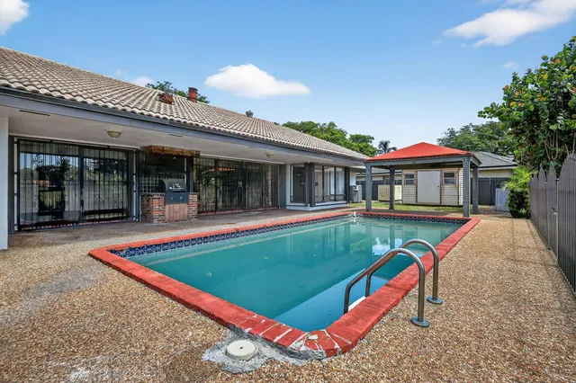 front view of a house with a swimming pool