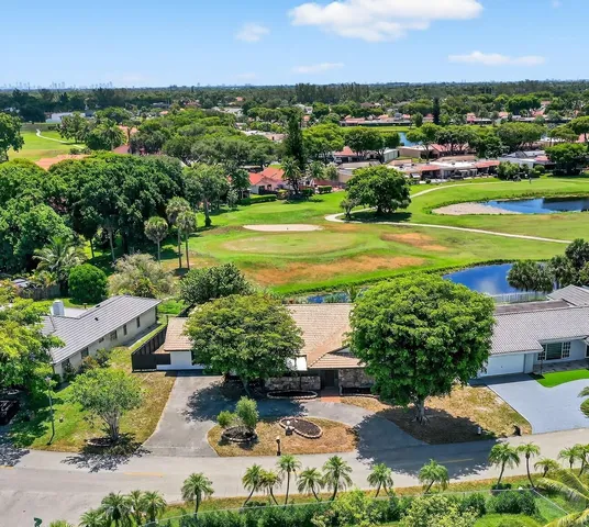 an aerial view of a houses with outdoor space and street view