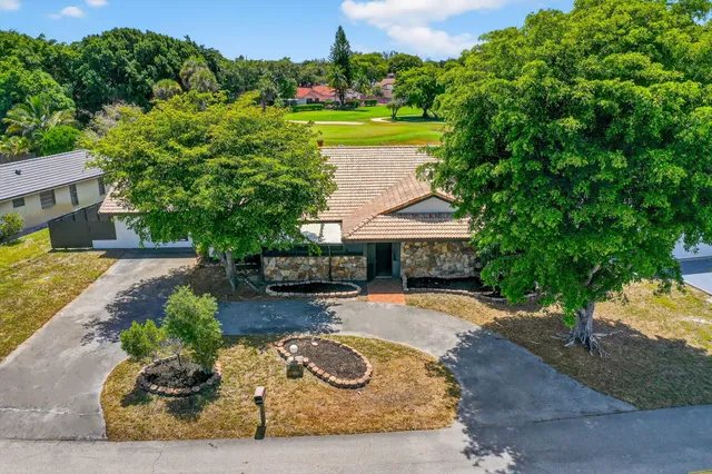 an aerial view of a house with a garden