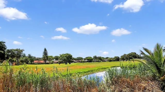 a view of a lake and houses in the back