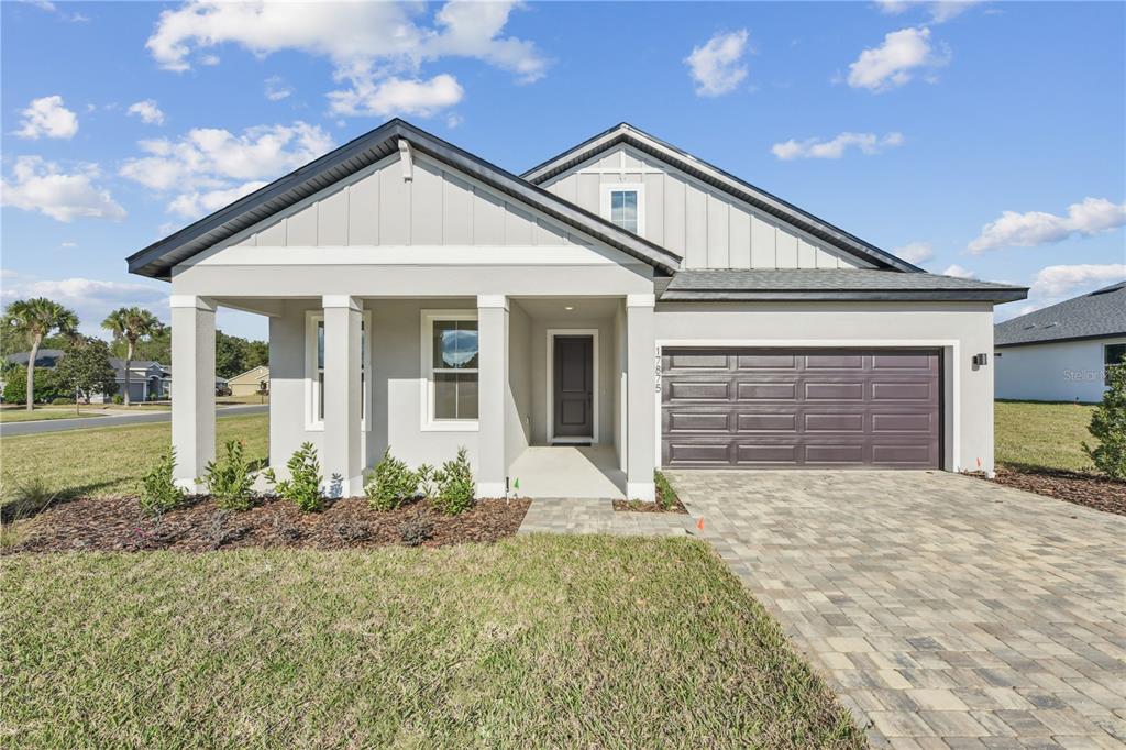 17875 Southwest 68th Place Dunnellon, FL 34432 - Photo 1 of 14 a front view of a house with garden