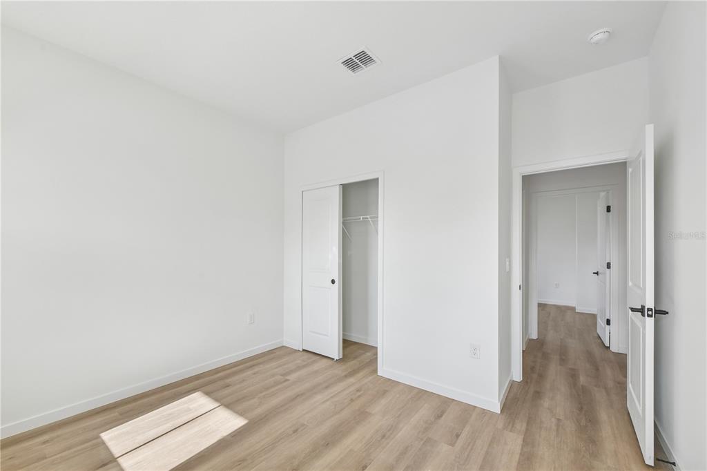 17875 Southwest 68th Place Dunnellon, FL 34432 - Photo 12 of 14 a view of a room with wooden floor and a bathroom