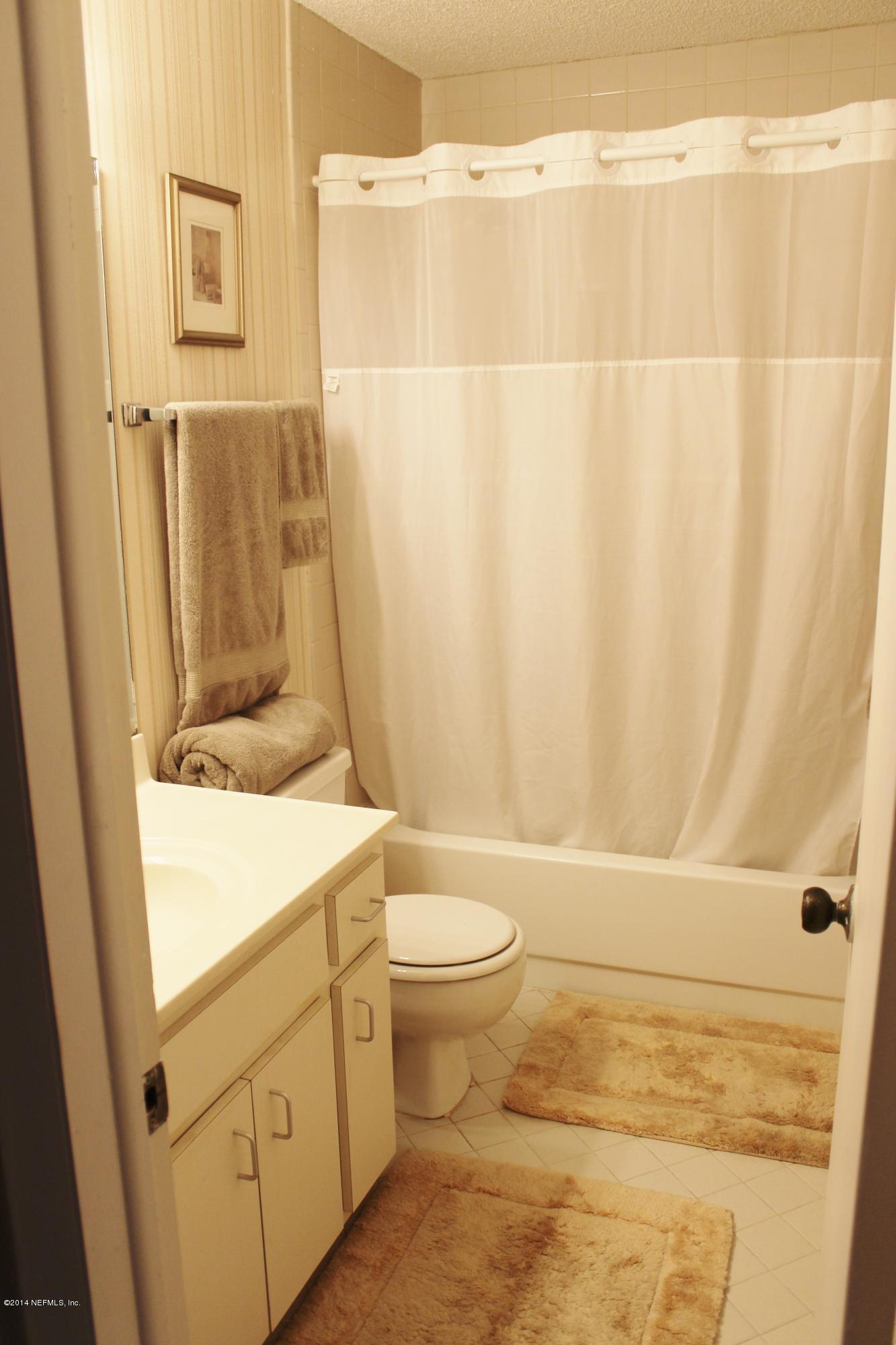 5512 Stanford Road Jacksonville, FL 32207 - Photo 15 of 22 a bathroom with a sink and a toilet
