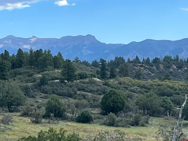 an aerial view of mountains in the background