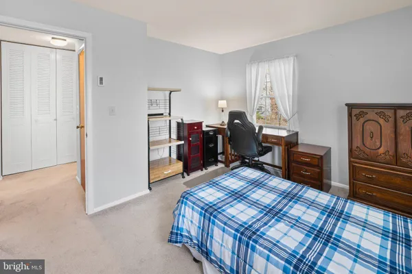 a bed room with a bed and a television