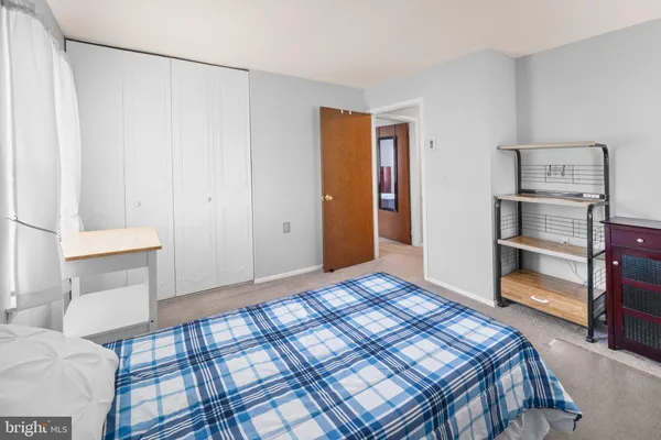 a bedroom with a bed and a cabinets