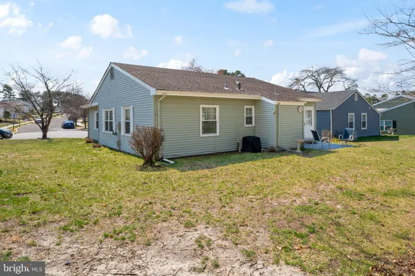a view of a house with a yard and a yard