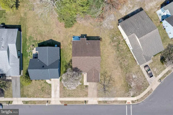 an aerial view of a house with a swimming pool