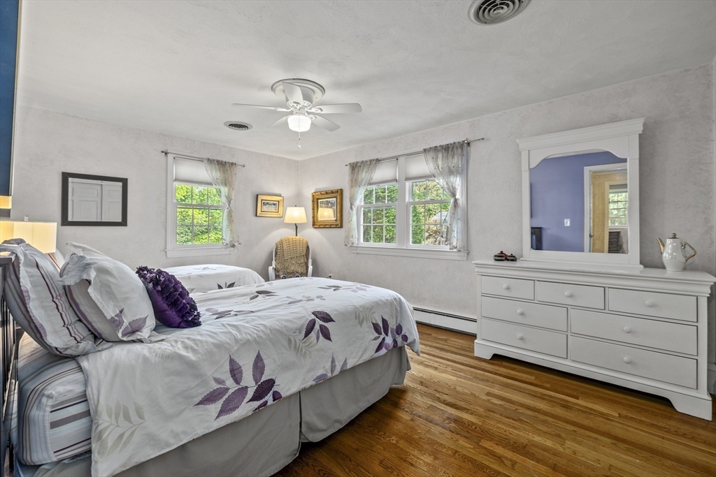 74 Brook Road Sharon, MA 02067 - Photo 19 of 32 a bedroom with a bed and a large window