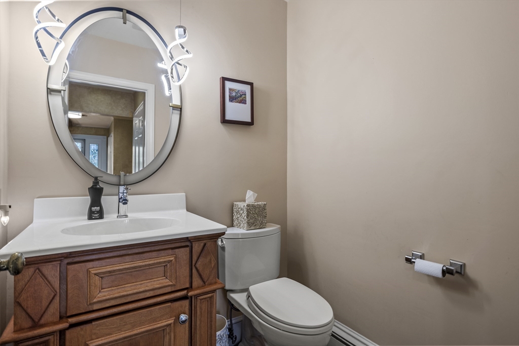 74 Brook Road Sharon, MA 02067 - Photo 27 of 32 a bathroom with a toilet a sink and mirror