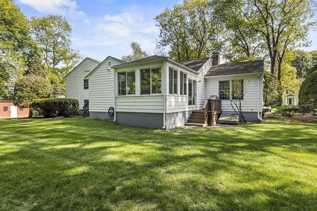 74 Brook Road Sharon, MA 02067 - Photo 29 of 32 a front view of house with yard and green space