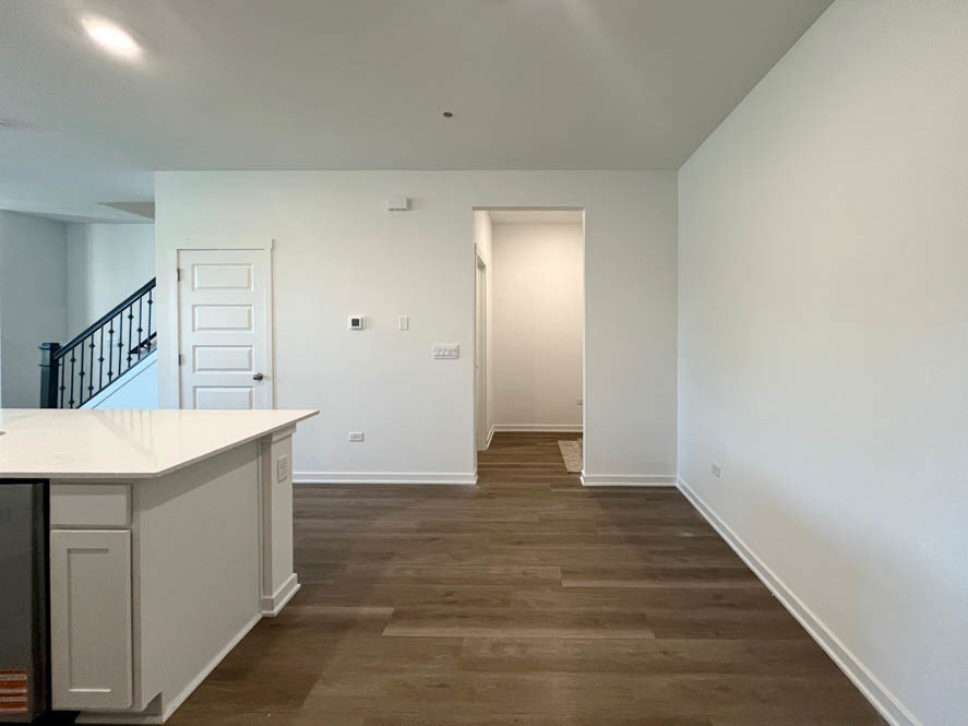 2108 Bodega Drive Oswego, IL 60543 - Photo 11 of 36 a view of kitchen with wooden floor