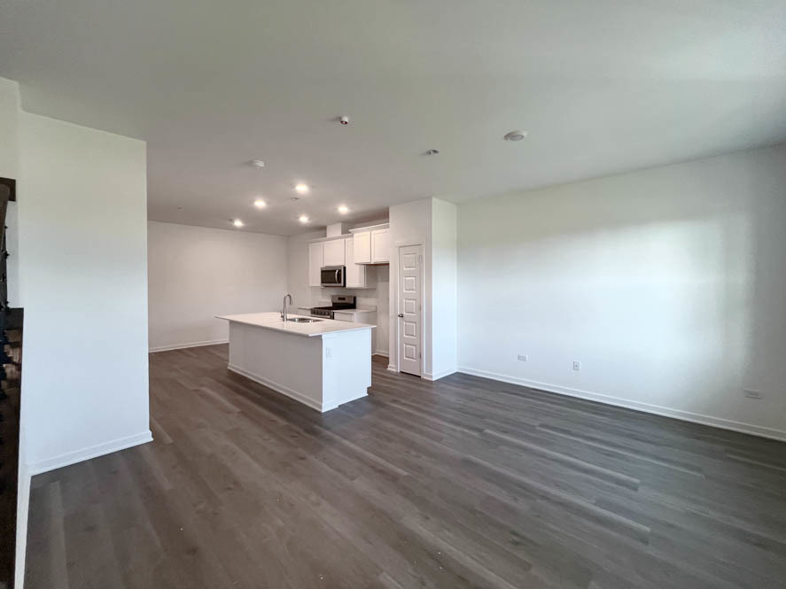 2108 Bodega Drive Oswego, IL 60543 - Photo 6 of 36 a view of kitchen with wooden floor