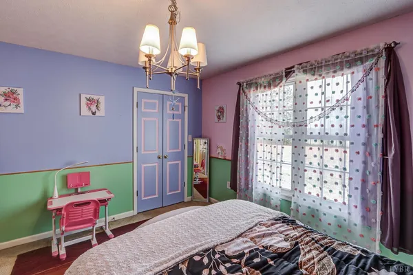 a bathroom with a sink vanity mirror and toilet