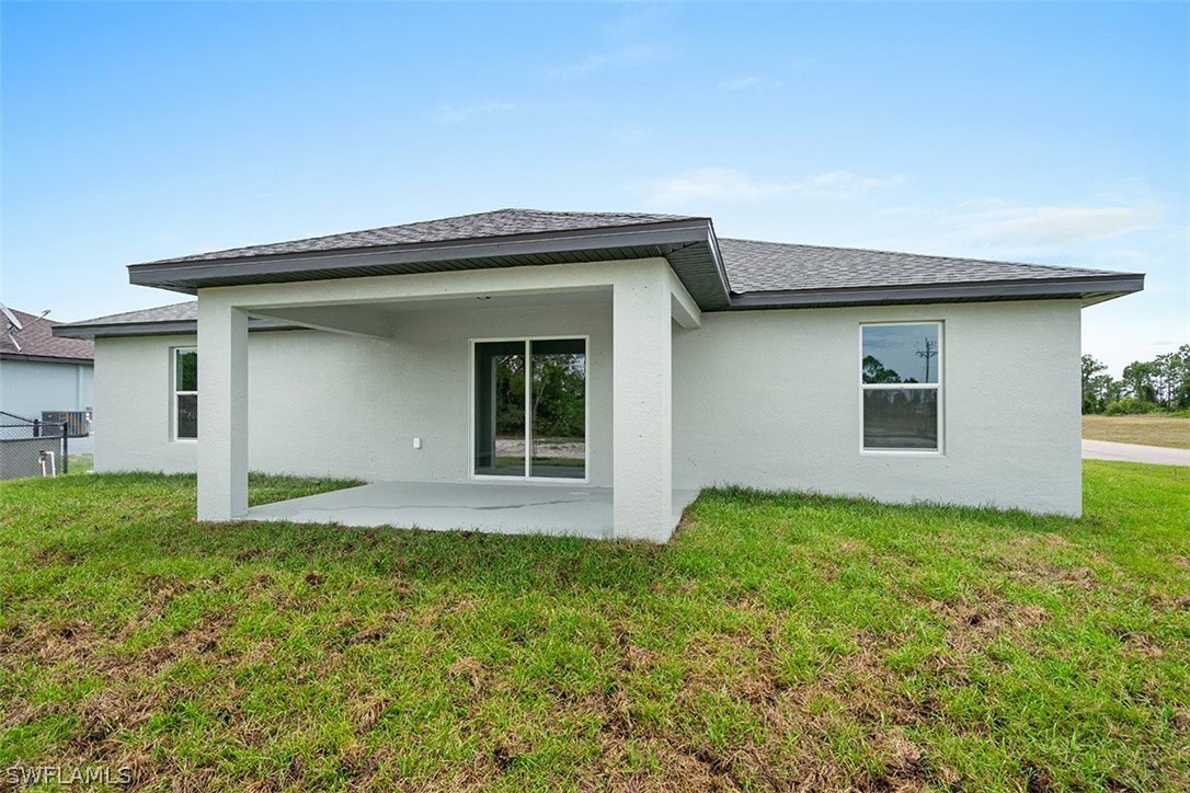 2819 37th Street Southwest Lehigh Acres, FL 33976 - Photo 14 of 14 a view of backyard of house