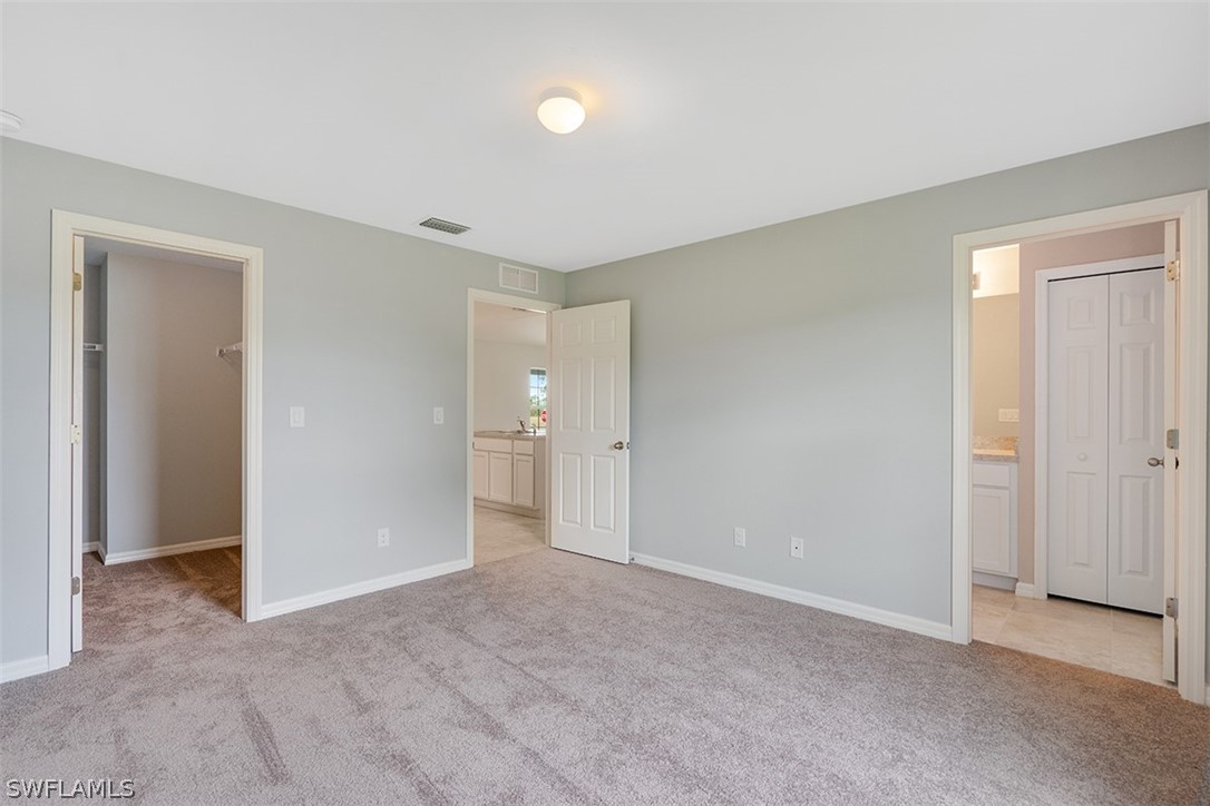 2819 37th Street Southwest Lehigh Acres, FL 33976 - Photo 10 of 14 a view of an empty room and closet area