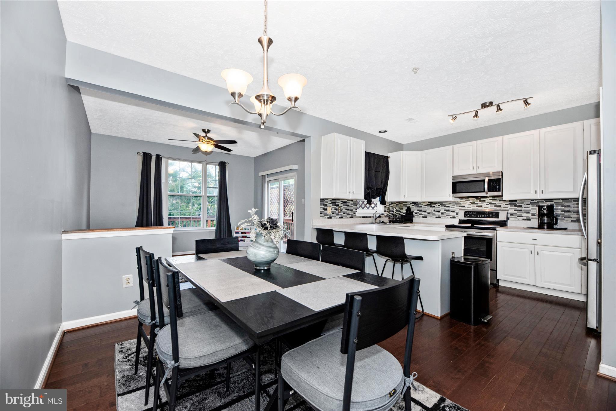 1422 Roman Ridge Way Bel Air, MD 21014 - Photo 11 of 57 a view of kitchen with granite countertop stainless steel appliances sink dining table and chairs