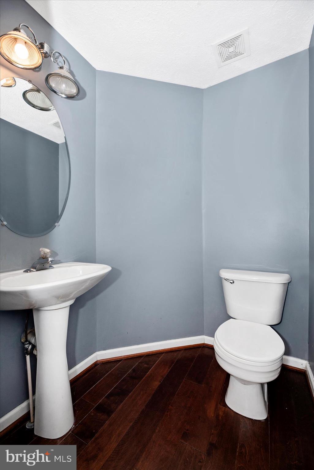 1422 Roman Ridge Way Bel Air, MD 21014 - Photo 23 of 57 a bathroom with a toilet sink and mirror